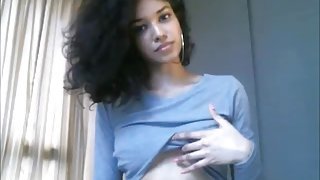 Sexy Ebony teen with curly hair teasing